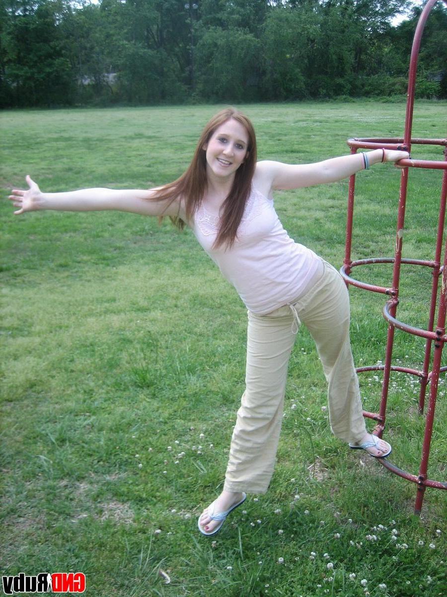 12P Cute ginger teen Ruby flashes her perky tits at the park while playing on the jungle gym