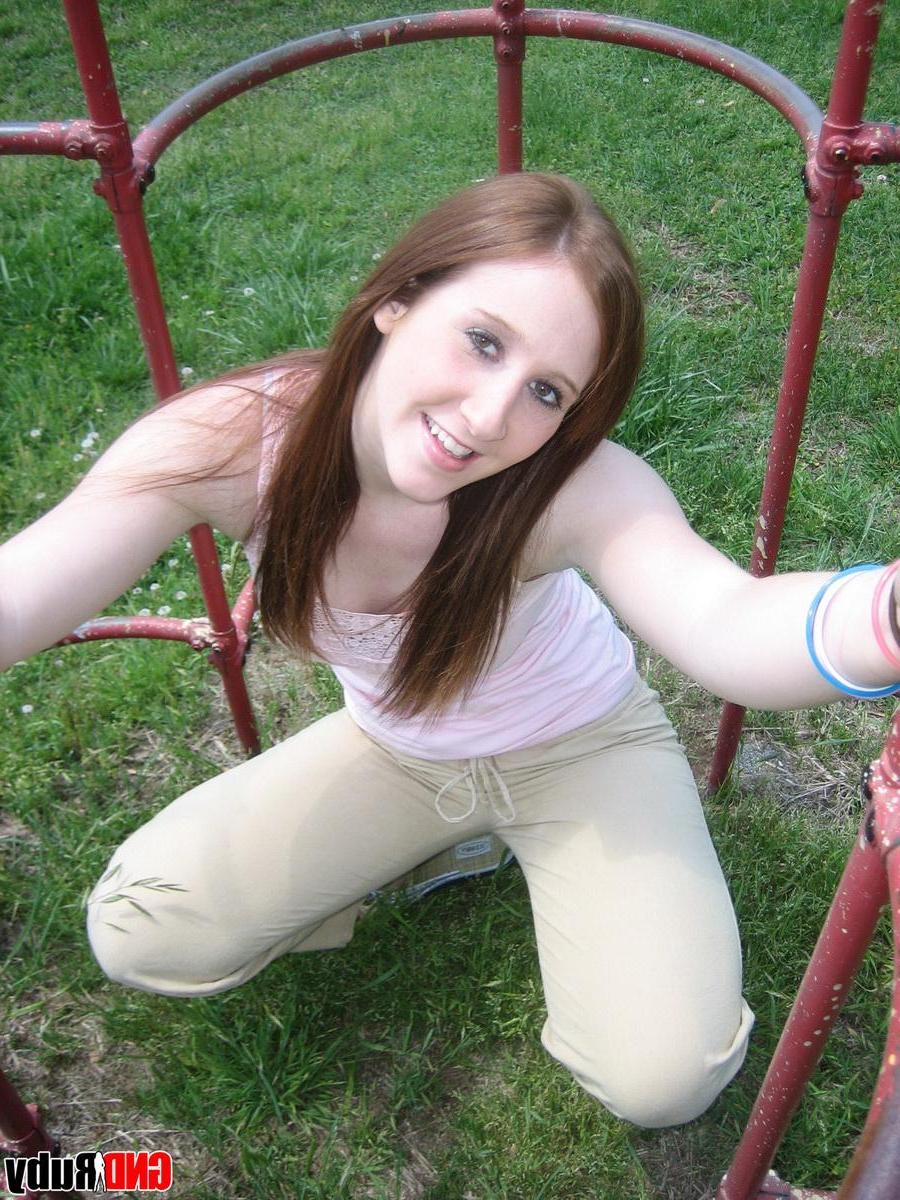 12P Cute ginger teen Ruby flashes her perky tits at the park while playing on the jungle gym