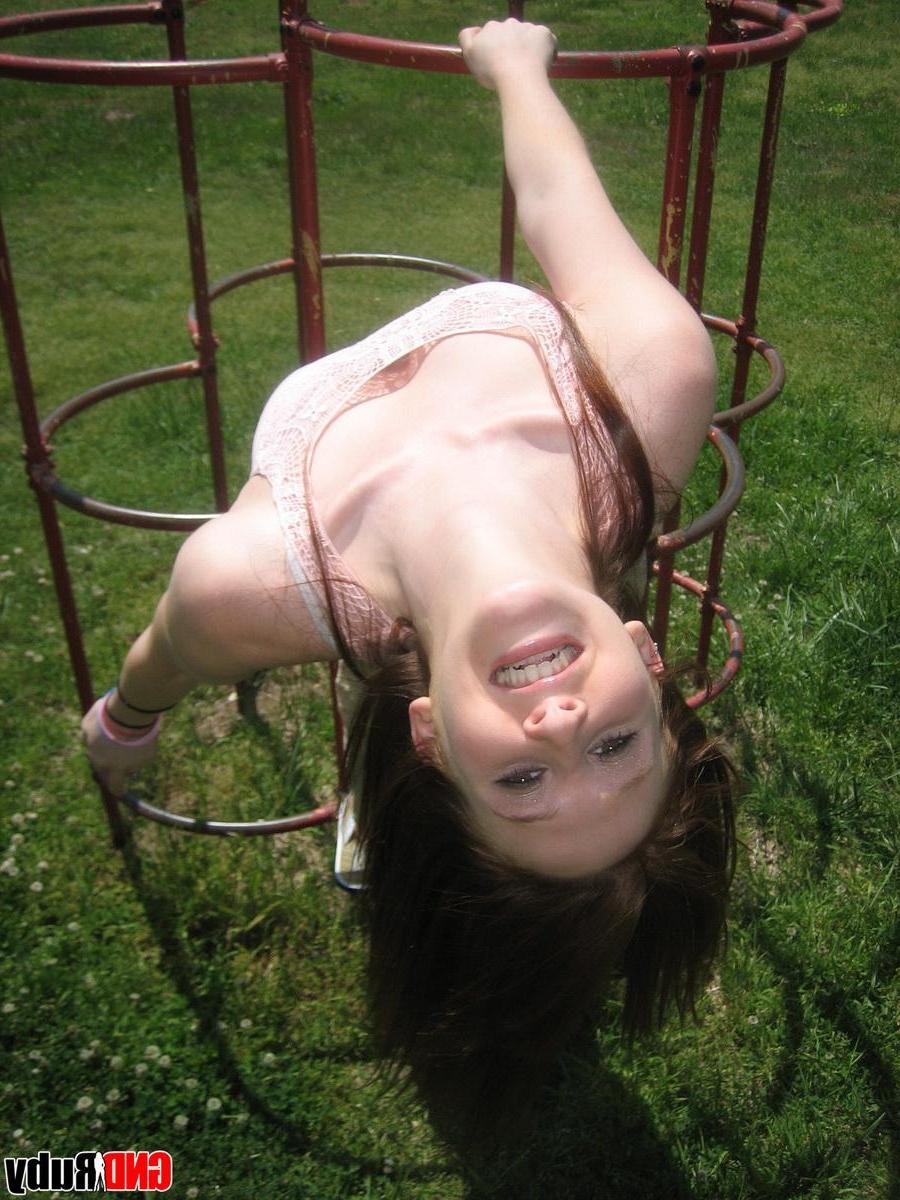 12P Cute ginger teen Ruby flashes her perky tits at the park while playing on the jungle gym