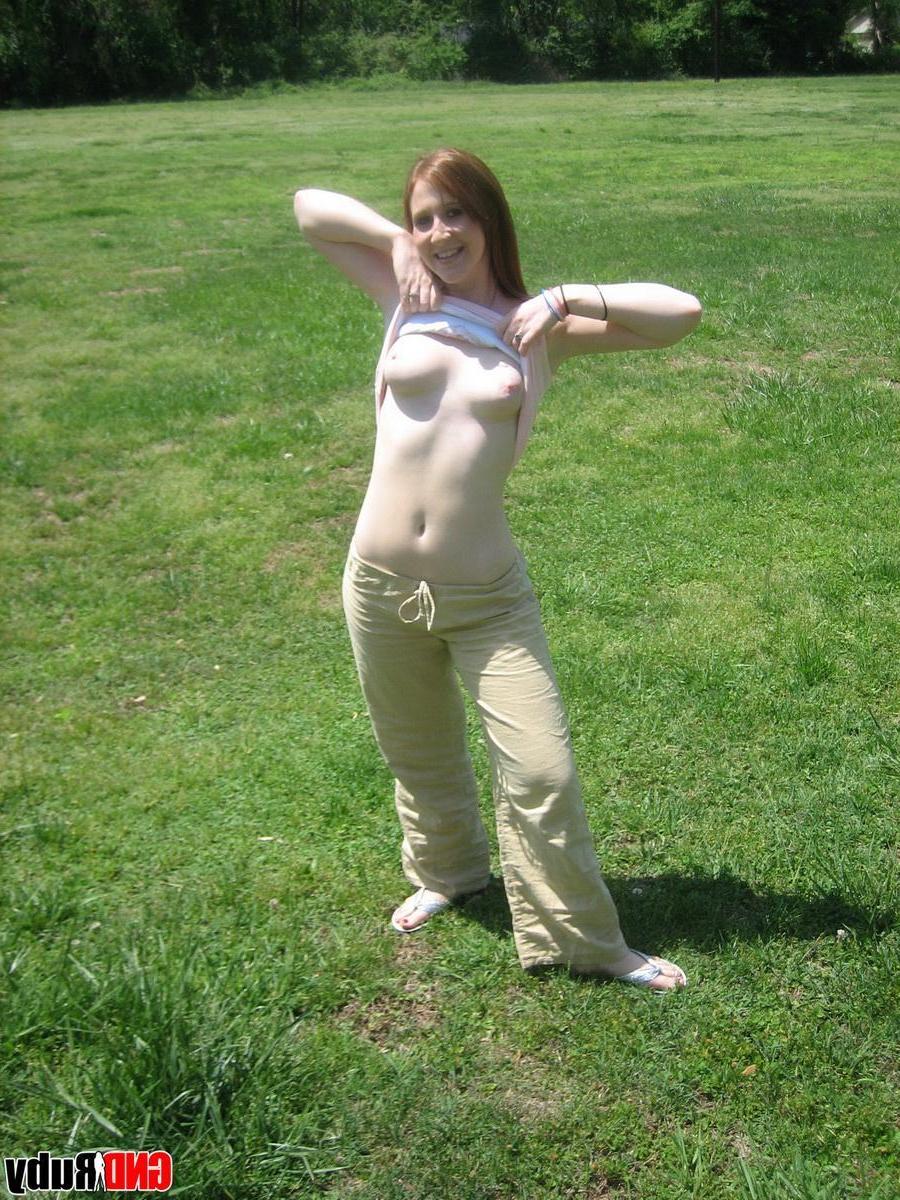 12P Cute ginger teen Ruby flashes her perky tits at the park while playing on the jungle gym