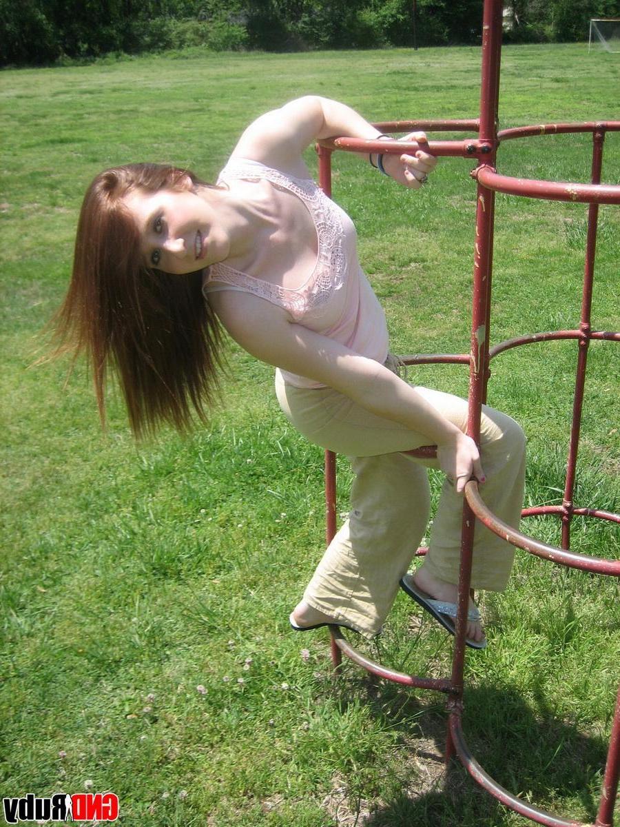 12P Cute ginger teen Ruby flashes her perky tits at the park while playing on the jungle gym