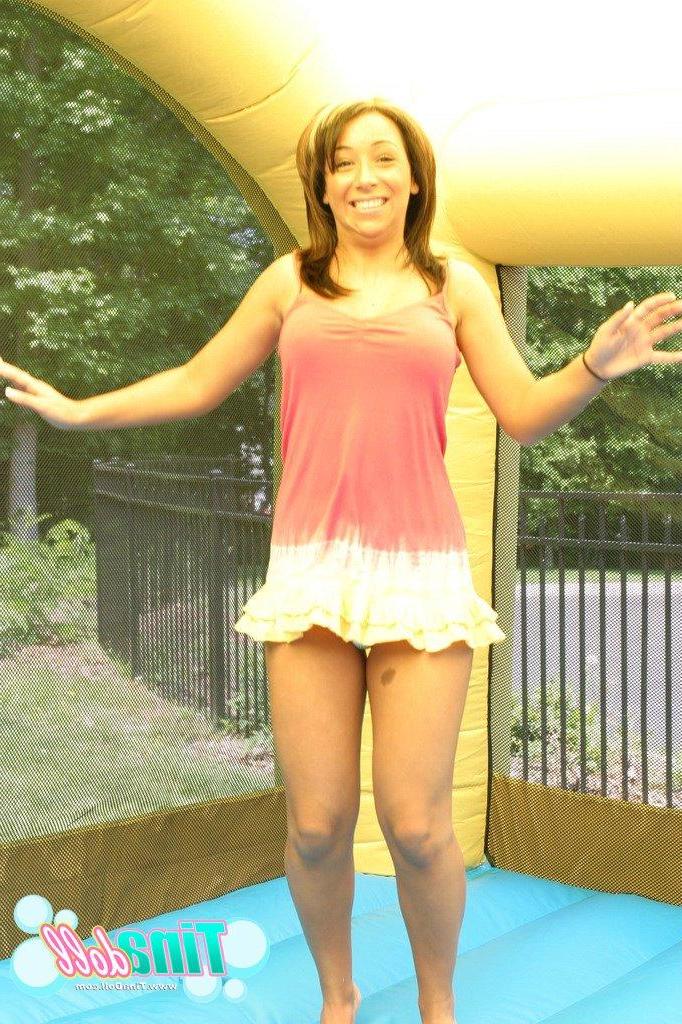 15P Tina Doll enjoying tit bouncing fun in an inflatable