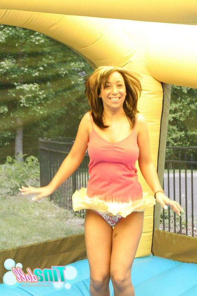15P Tina Doll enjoying tit bouncing fun in an inflatable