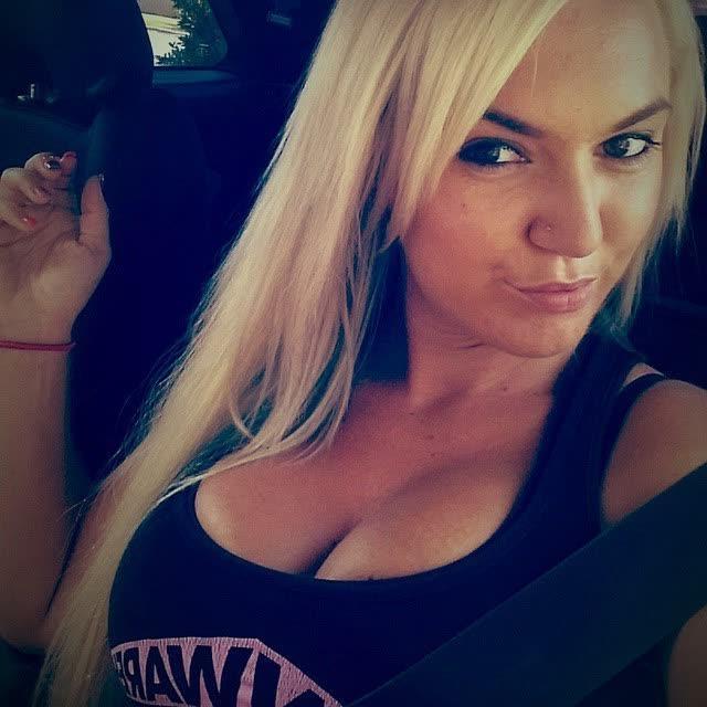 14P Heavy-chested blonde bombshell spilling out of her top