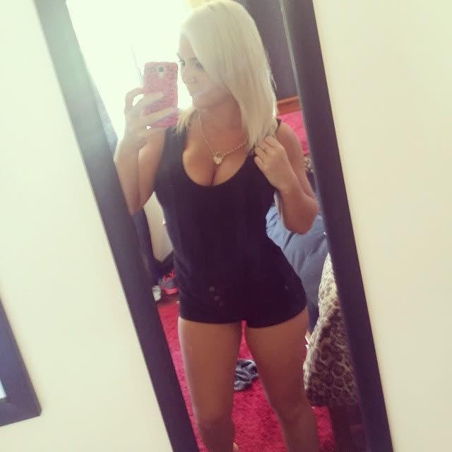 14P Heavy-chested blonde bombshell spilling out of her top