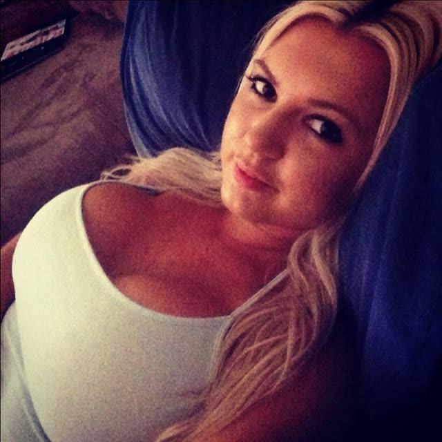 14P Heavy-chested blonde bombshell spilling out of her top
