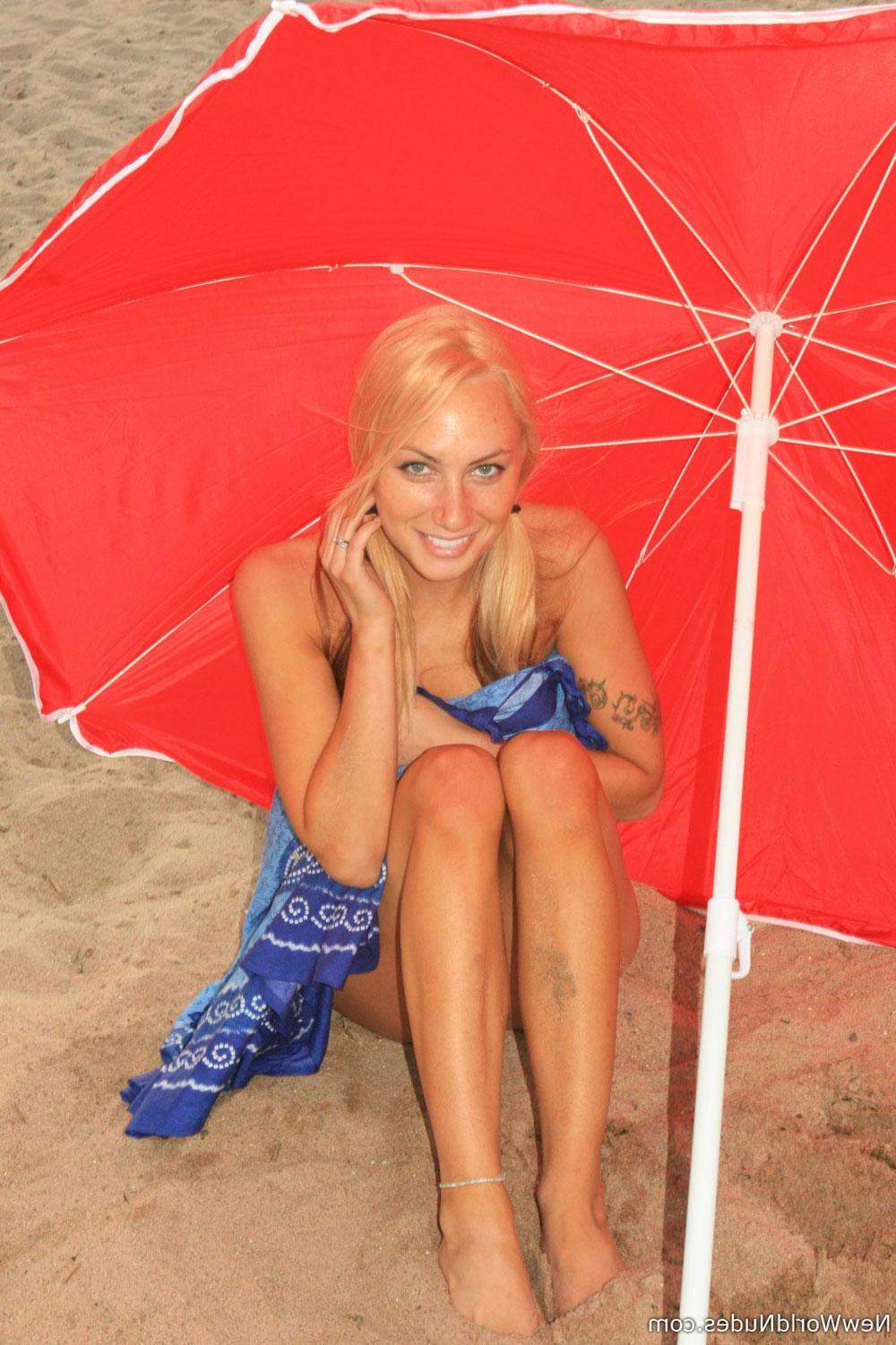 16P Blonde beauty Oxana strips nude and gives you her tight body