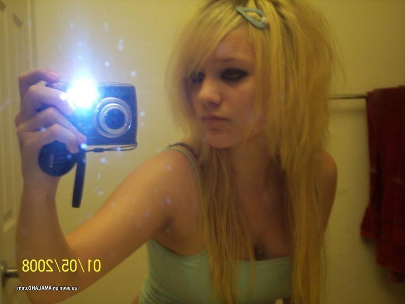 15P Hot blonde babe showing off her fine tits on cam