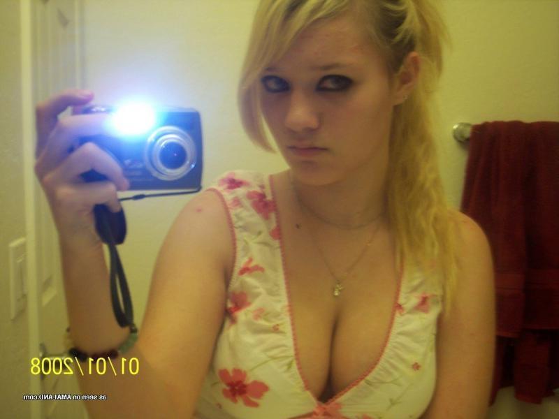 15P Hot blonde babe showing off her fine tits on cam