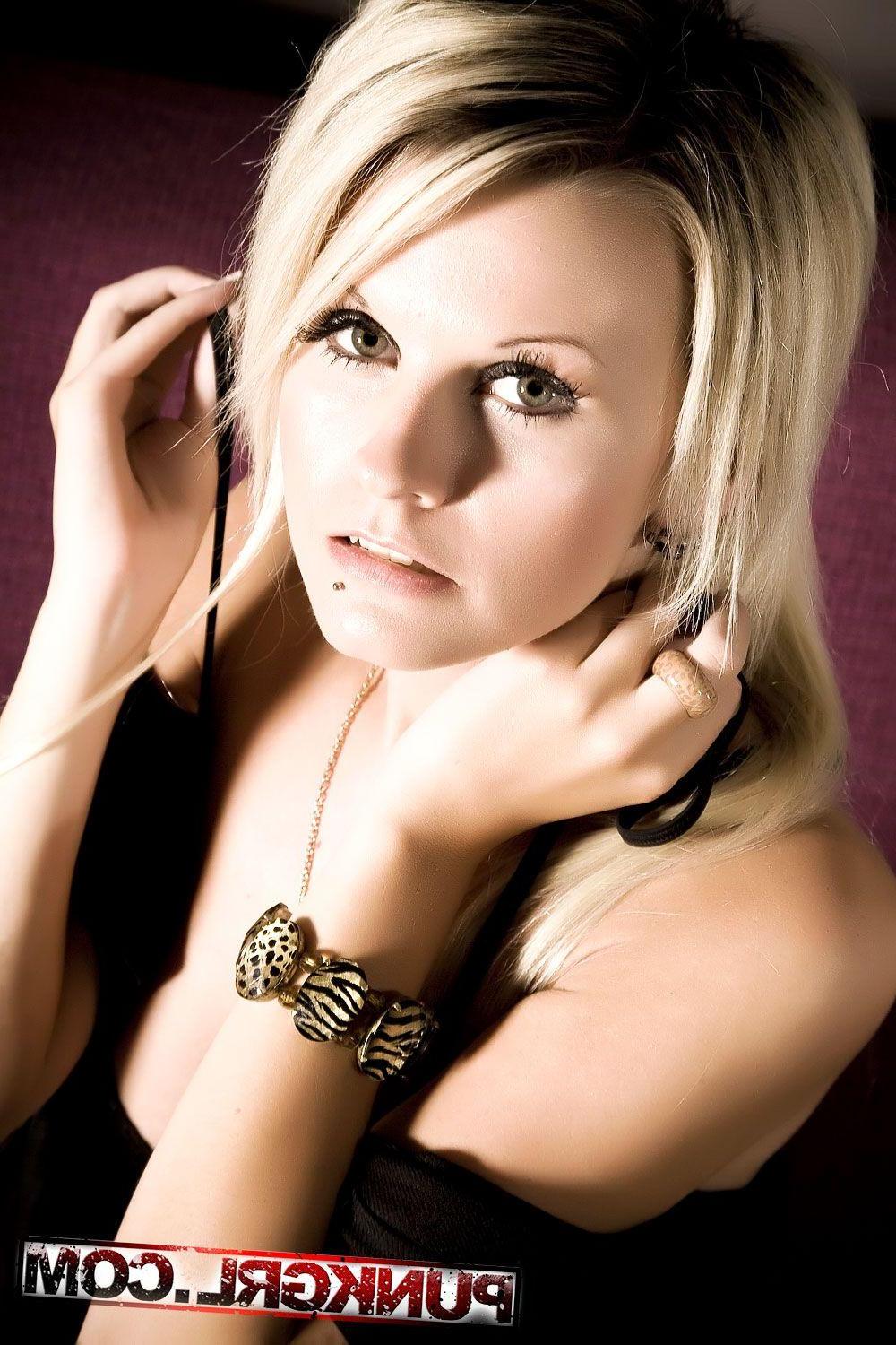 15P Pictures of blonde teen Janneke teasing on the couch