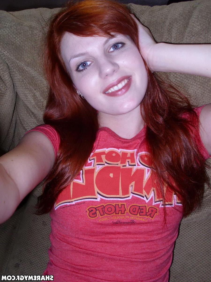 12P Redhead girlfriend takes selfshot pictures on the couch