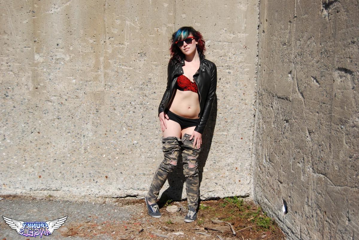 12P Horny tease Sabrina shows off her round ass outdoors as she pulls down her pants