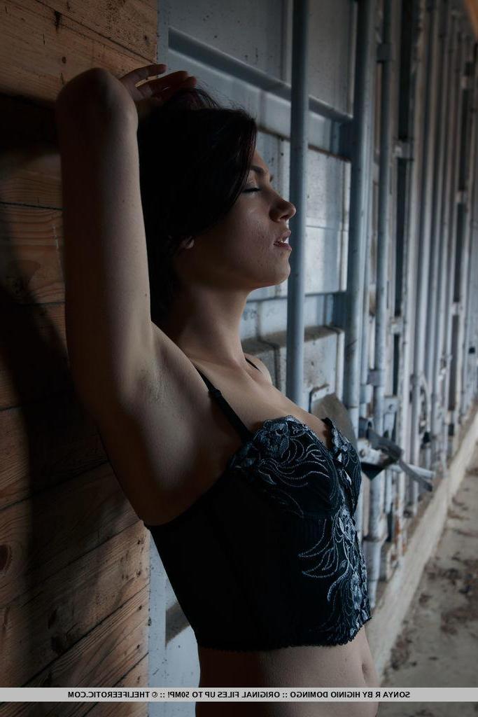 16P Sonya R all wet and horny sits by the wall as she penetrates her pussy with a bottle