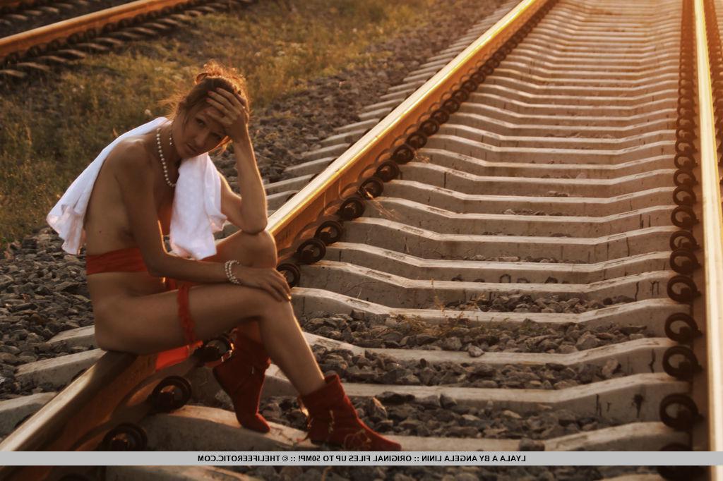 16P Brunette babe Lyala A pulls down her panties on the train tracks