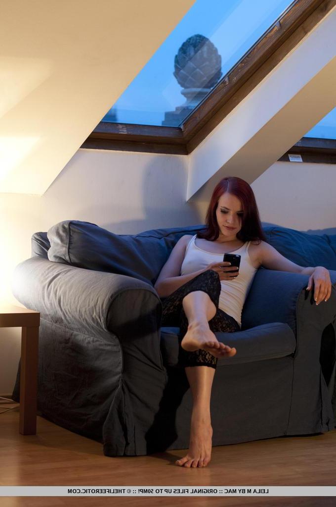 16P Redhead girl Leila M feels horny on the couch and decides to strip naked