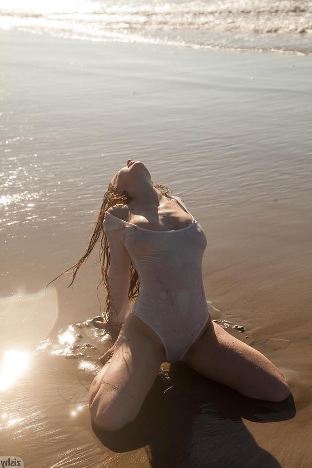 8P Busty brunette Avri Gaines gets naughty and flashes her boobs at the beach