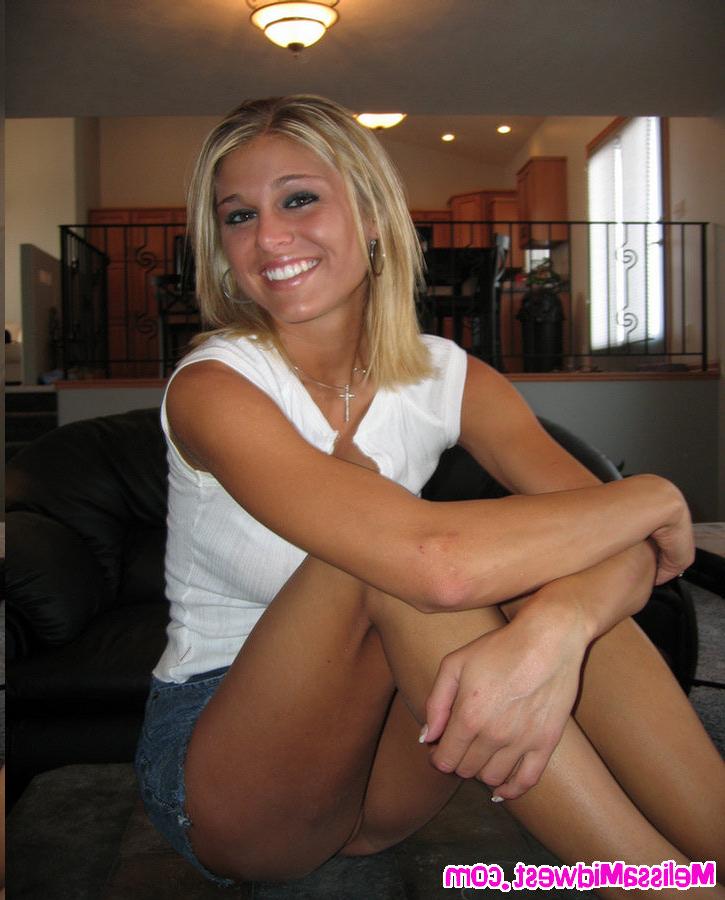 16P Melissa Midwest in a white top and jean skirt on the couch