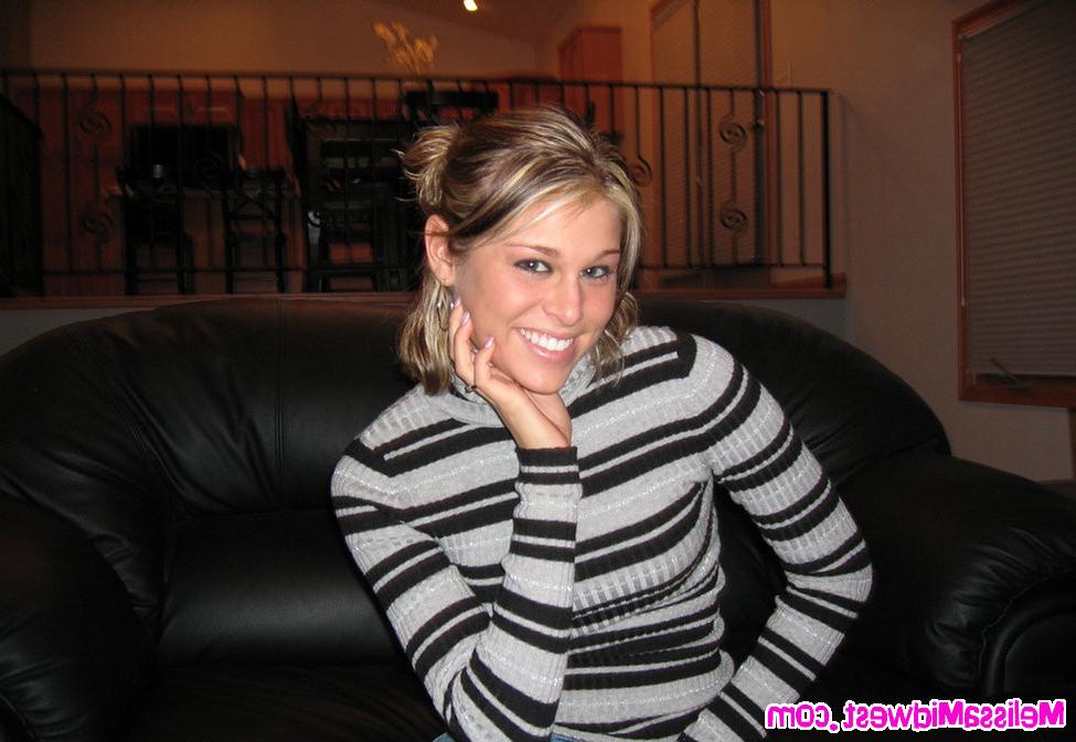 15P Melissa Midwest on the couch with jeans and a striped shirt