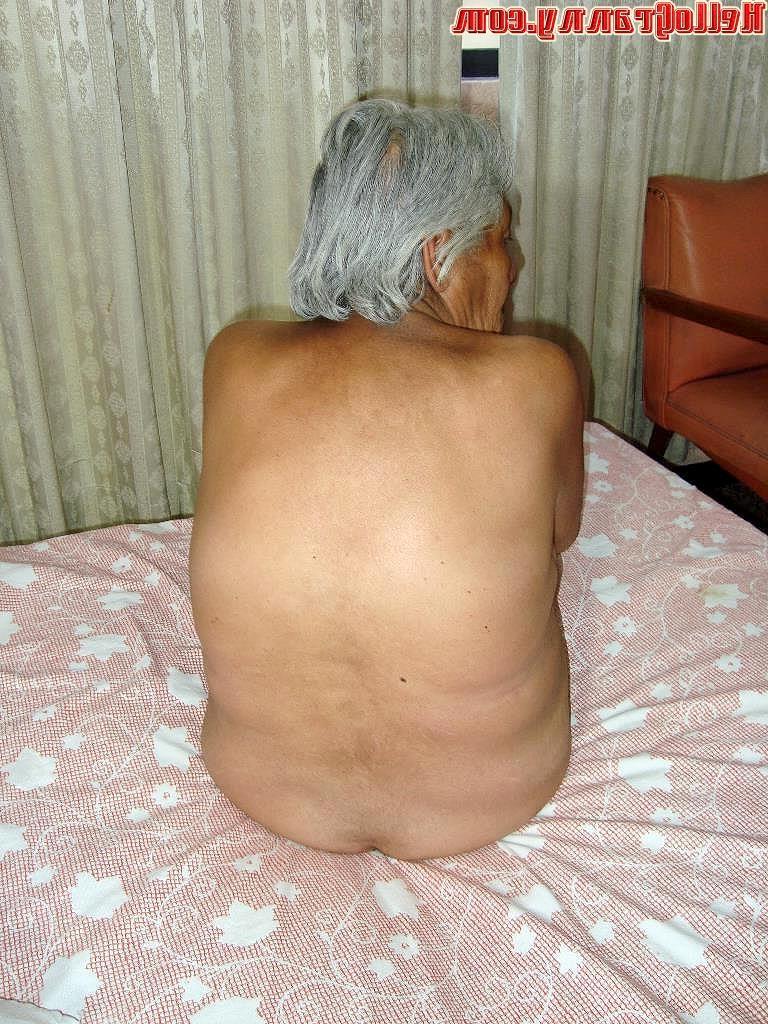 16P Sexy and hot grandmother posing in bed