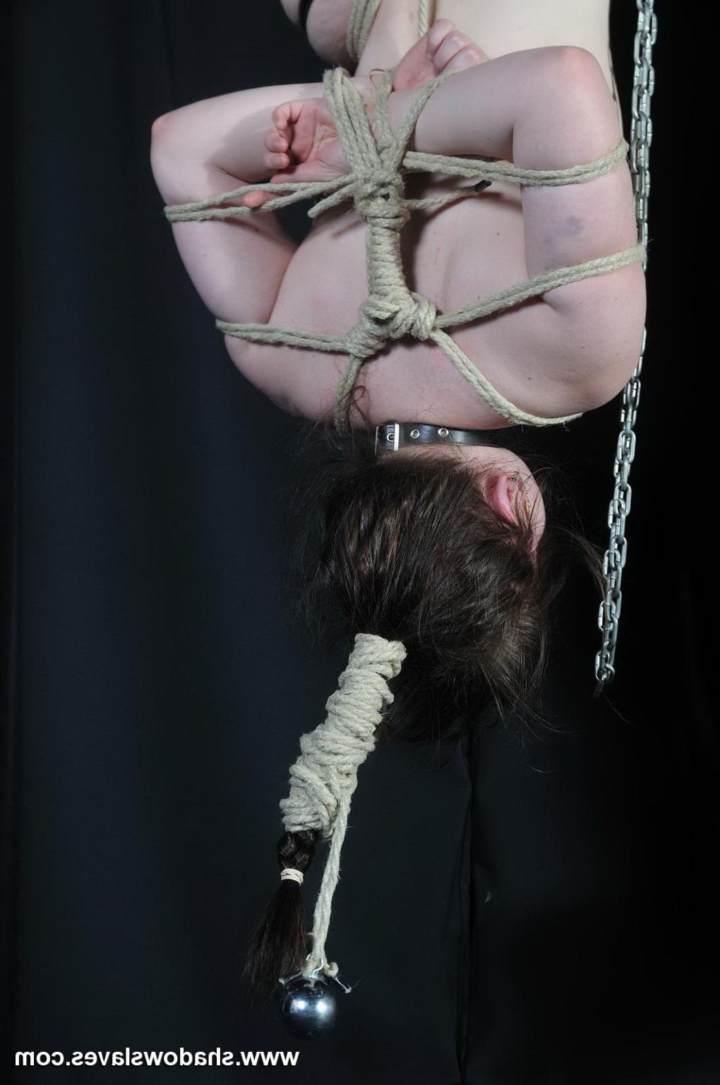16P Amateur subbie Louise is suspended in bondage by one foot and th