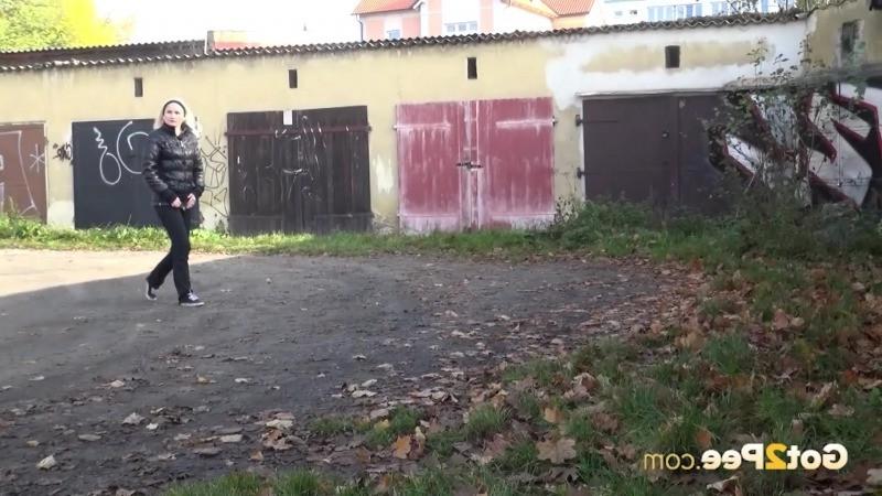 15P Blonde babe pees next to some garages