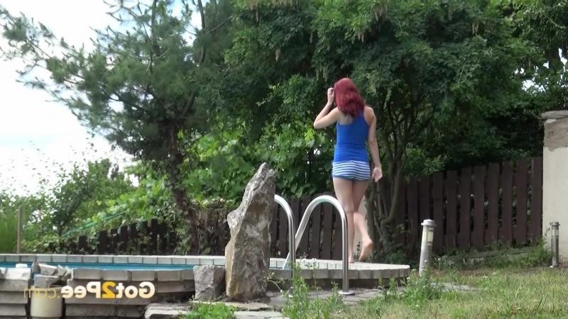 15P Redhead pisses in her neighbours swimming pool