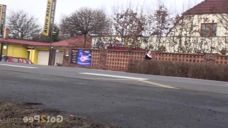 15P Brunette girl needs to pee while walking by a road