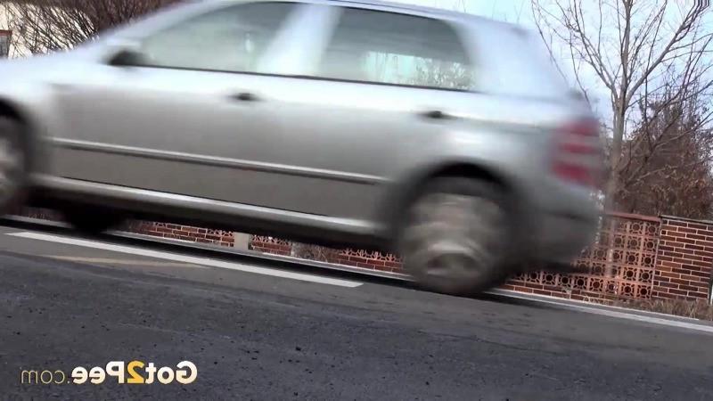15P Brunette girl needs to pee while walking by a road