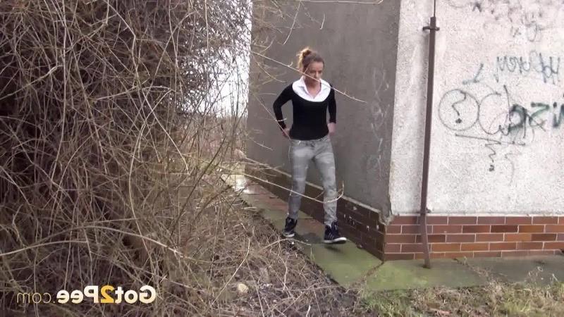 15P Brunette girl needs to pee while walking by a road