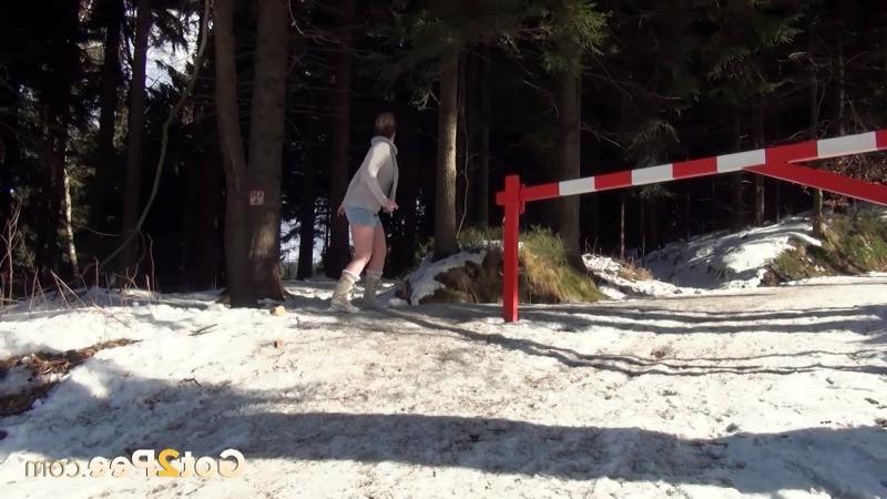 15P Pretty brunette lifts up her skirt to piss in the snow