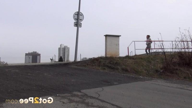 15P Sexy brunette pissing on an industrial estate