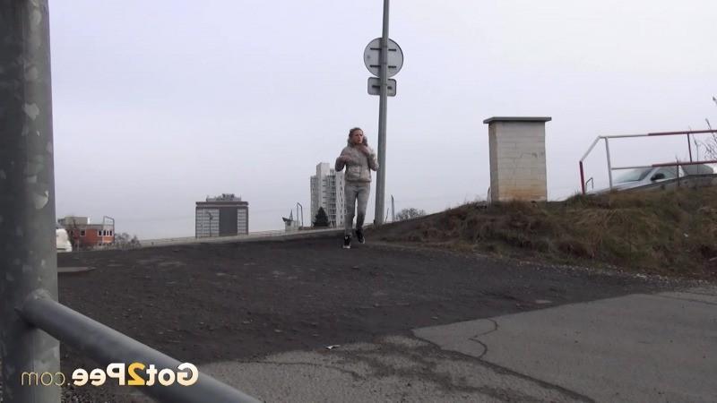 15P Sexy brunette pissing on an industrial estate