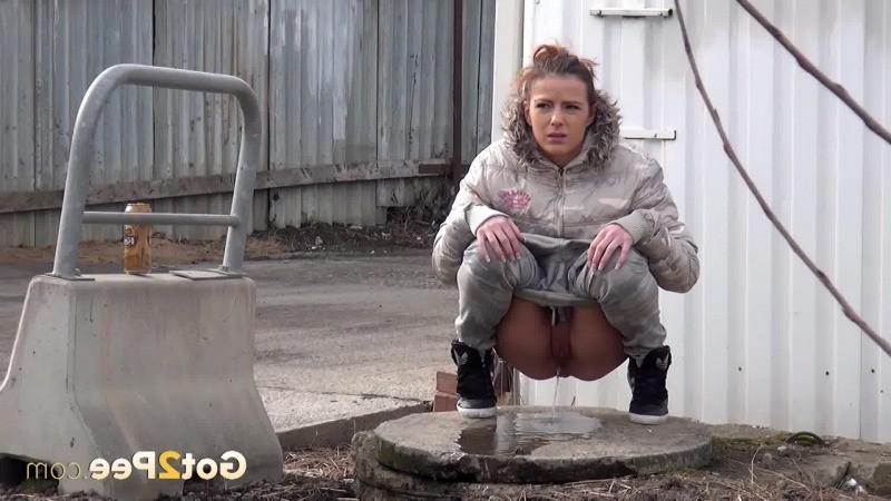 15P Sexy brunette pissing on an industrial estate