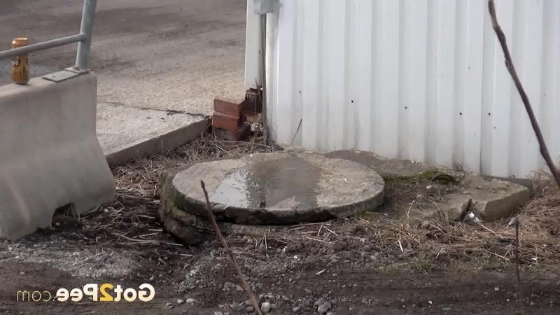 15P Sexy brunette pissing on an industrial estate