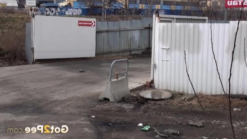 15P Sexy brunette pissing on an industrial estate