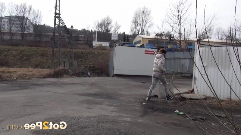 15P Sexy brunette pissing on an industrial estate