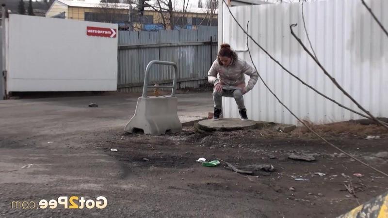 15P Sexy brunette pissing on an industrial estate