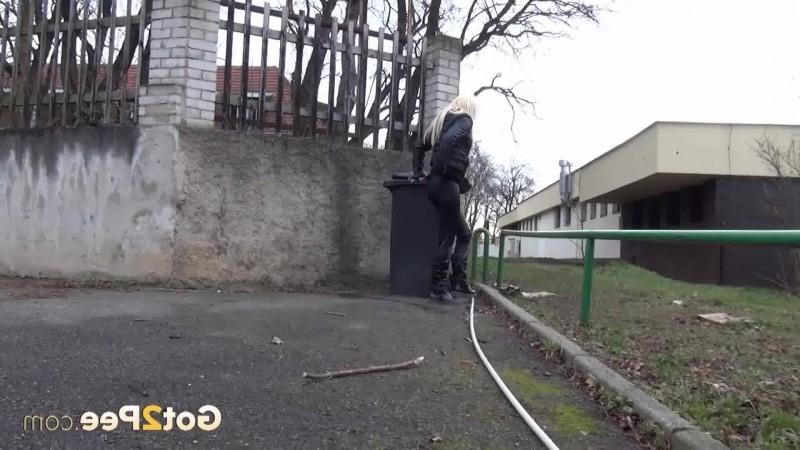 15P A pretty blonde pulls down her trousers to pee