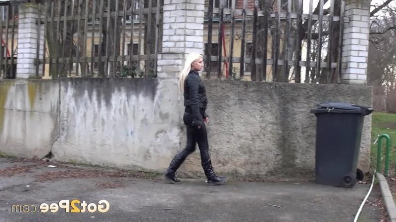 15P A pretty blonde pulls down her trousers to pee