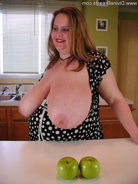 15P Chubby amateur babe lays her gigantic tit on the table