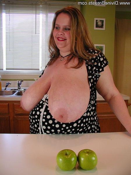 15P Chubby amateur babe lays her gigantic tit on the table