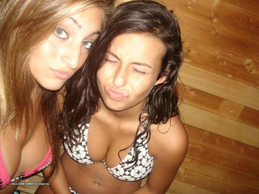 11P Photos of two amateur sexy teen lesbo lovers posing