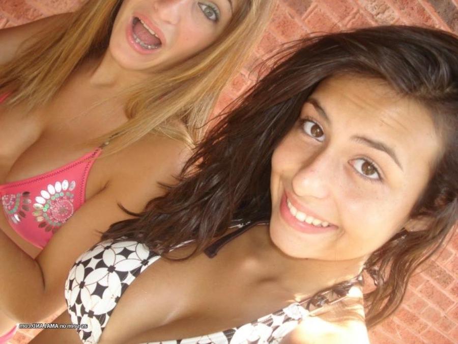 11P Photos of two amateur sexy teen lesbo lovers posing