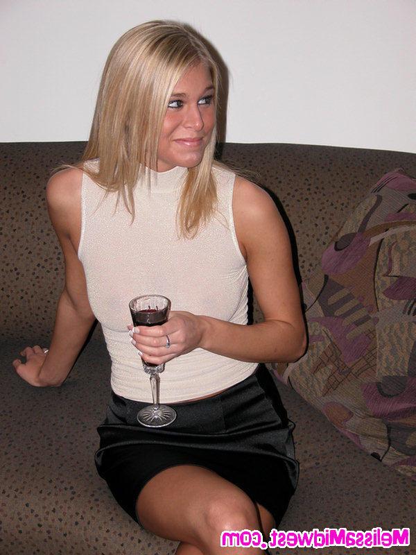 16P Melissa Midwest on the couch with a glass of wine