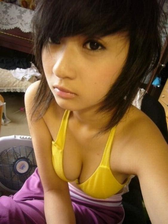 16P Asian does a stiptease befoe sliding her pussy on huge cock