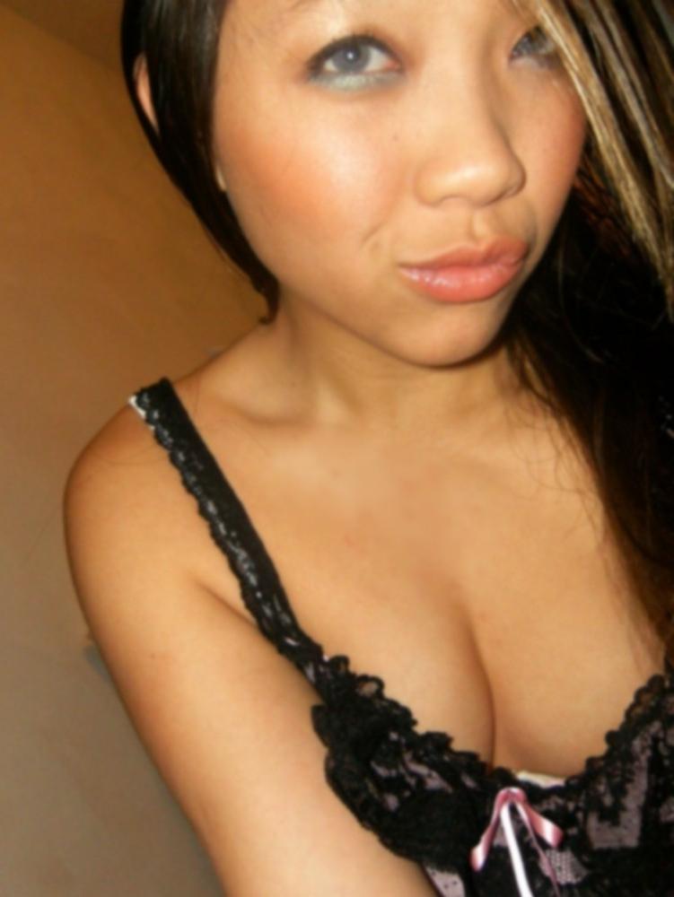 16P Asian does a stiptease befoe sliding her pussy on huge cock