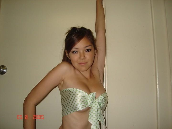 16P Asian does a stiptease befoe sliding her pussy on huge cock