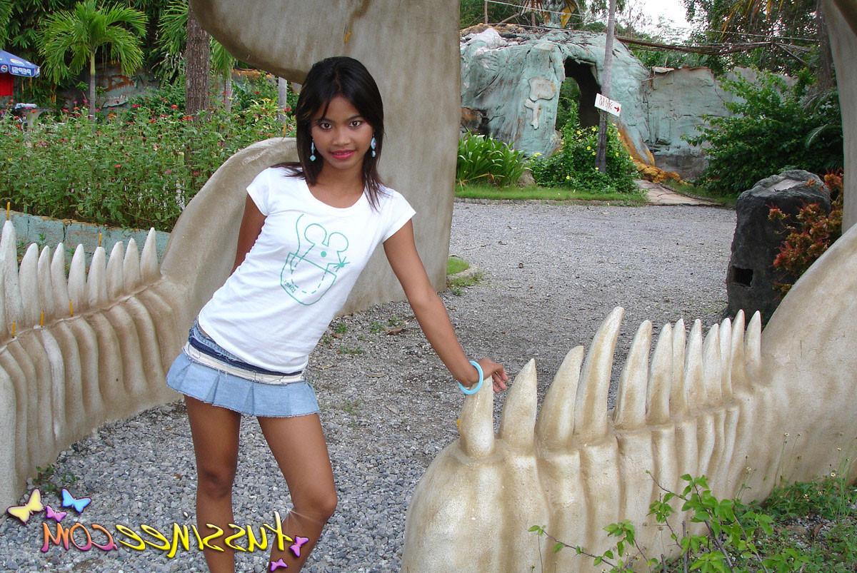 15P Asian Teen Tussinee doing some public flashing in a dinosaur park
