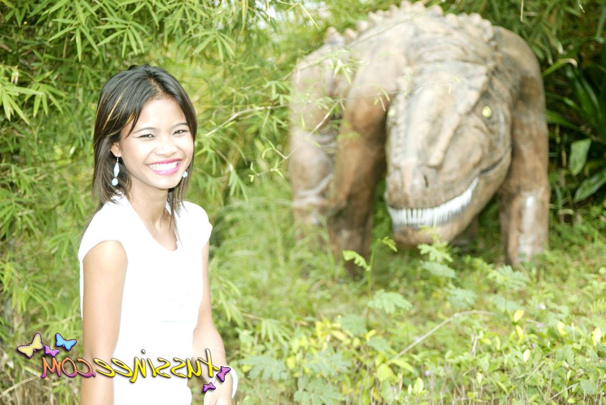 15P Asian Teen Tussinee doing some public flashing in a dinosaur park