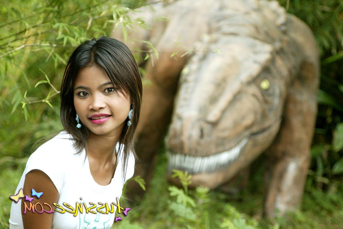 15P Asian Teen Tussinee doing some public flashing in a dinosaur park